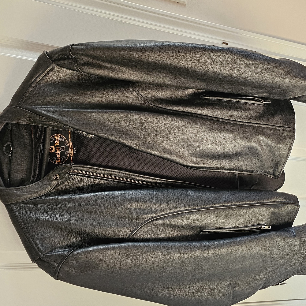 Black Leather Biker Jacket with Diagonal Zipper and Snap-Down Collar